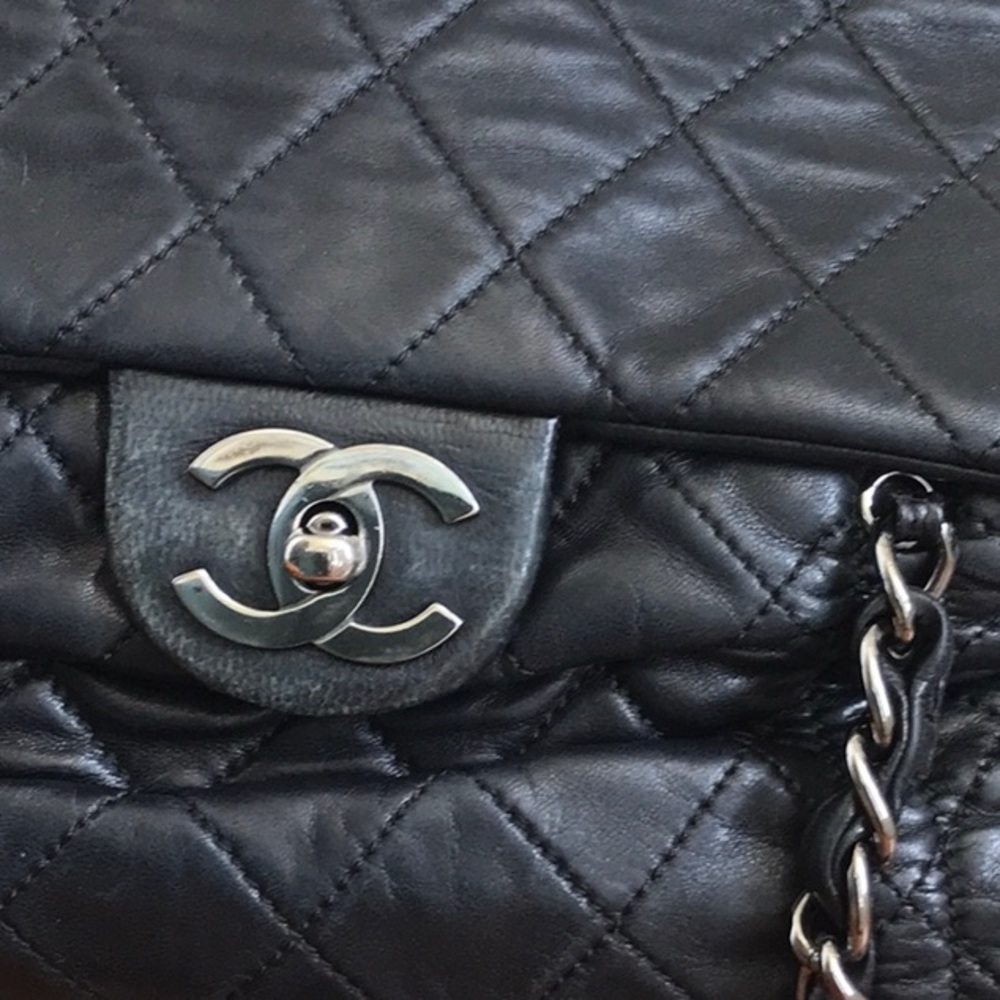 Authentic Chanel quilted leather black bag.